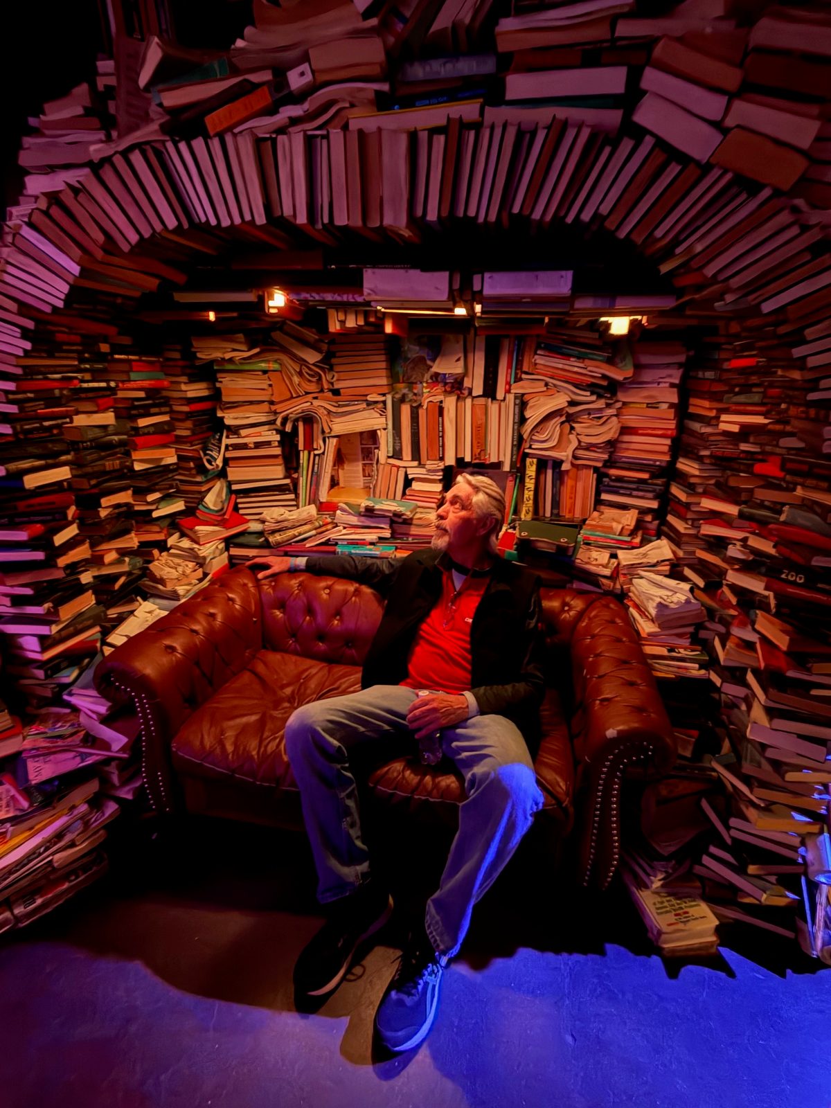 Robert A. Wehrmeyer surrounded by books